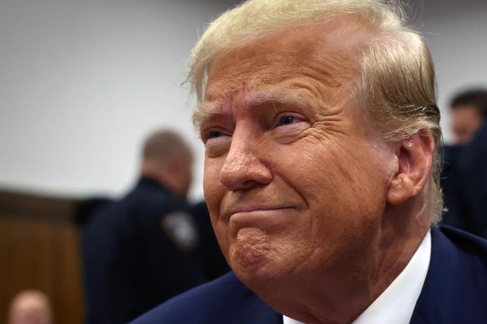 Donald Trump sits in a Manhattan criminal courtroom with members of his legal team for the continuation of his hush money trial on April 25, 2024 in New York City.