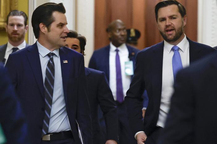 Former Rep. Matt Gaetz, R-Fla., (left) is seen on Capitol Hill Wednesday to discuss with senators his nomination to be attorney general under President-elect Donald Trump. He is escorted by Vice President-elect JD Vance.