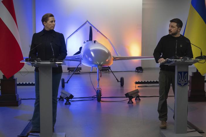 Ukraine's President Volodymyr Zelenskyy speaks with Danish Prime Minister Mette Frederiksen on Nov. 19 in front of a drone the Ukrainians have built with funding from Denmark. Ukraine has rapidly developed an extensive drone industry that plays a critical role in the war with Russia. The inexpensive, homemade drones carry out attacks on the frontline in Ukraine and also deep inside Russia.