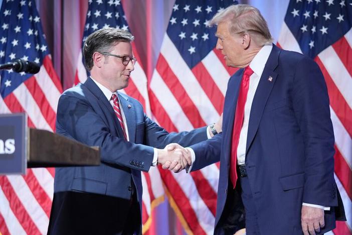 U.S. Speaker of the House Mike Johnson shakes hands with U.S. President-elect Donald Trump at a House Republicans Conference meeting at the Hyatt Regency on Capitol Hill on Nov. 13, 2024 in Washington.