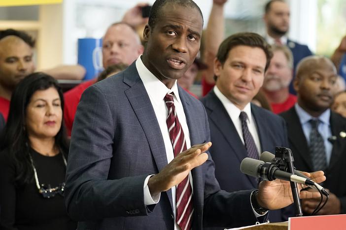 Florida's surgeon general, Joseph Ladapo, recommended Friday that local jurisdictions stop adding fluoride to drinking water. He is pictured here at a bill signing by Gov. Ron DeSantis on Nov. 18, 2021, in Brandon, Fla. The bill banned vaccine mandates for public sector employees and school districts.