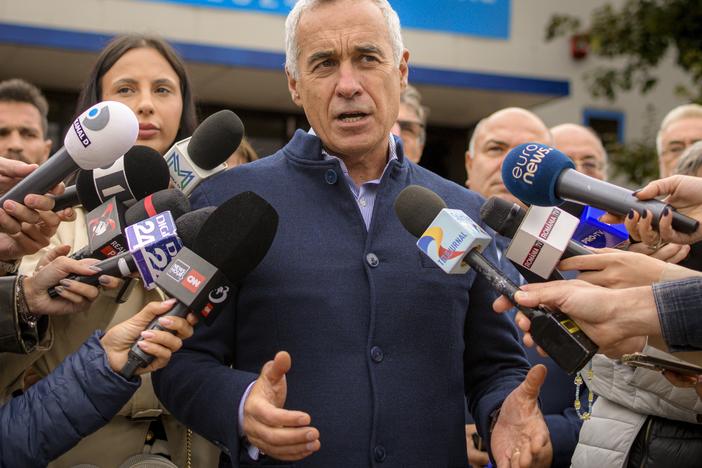 Calin Georgescu, running as an independent candidate for president, speaks to media after registering his bid in the country's presidential elections, in Bucharest, Romania, Tuesday, Oct. 1, 2024.