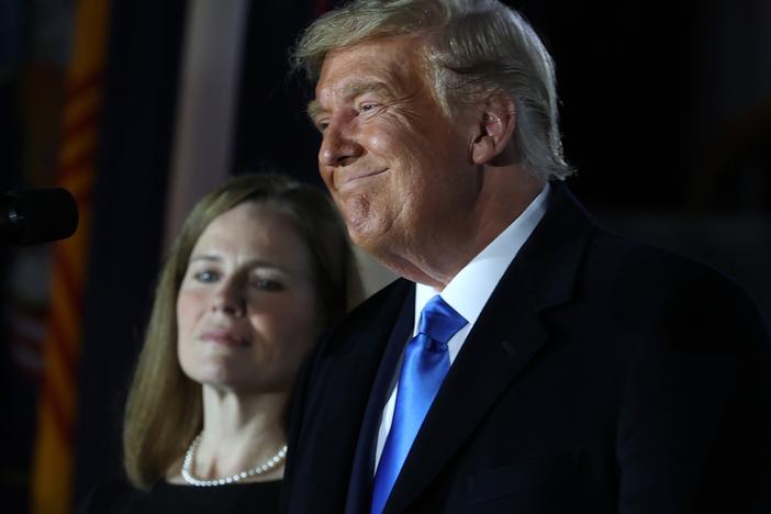 Then-President Donald Trump stands next to Judge Amy Coney Barrett before her ceremonial swearing-in for the position of the U.S. Supreme Court associate justice in 2020.