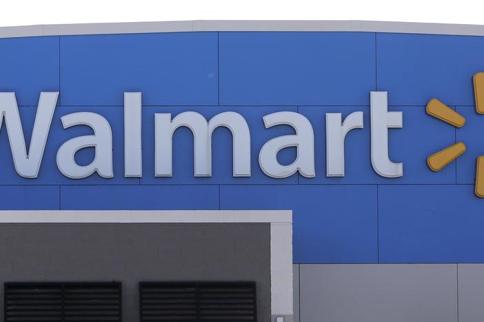 A Walmart logo is displayed outside of a Walmart store in Walpole, Mass.