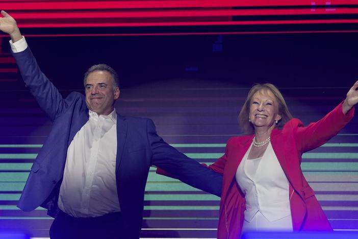 Yamandu Orsi, candidate for the Broad Front (Frente Amplio) and running mate Carolina Cosse, right, celebrate after polls closed in the presidential run-off election in Montevideo, Uruguay, on Sunday.