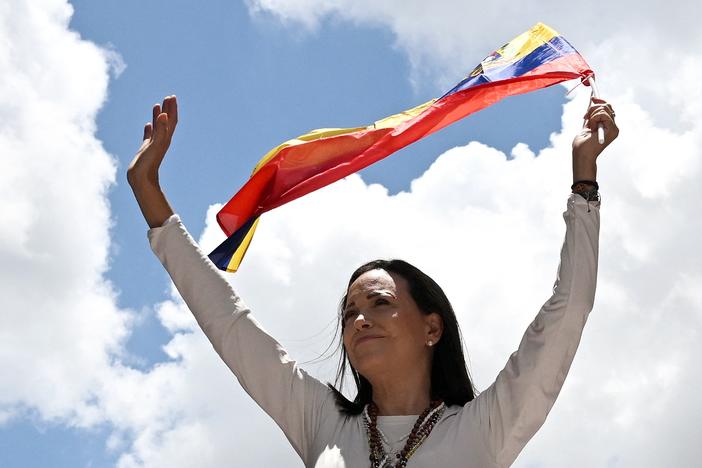 Venezuelan opposition leader Maria Corina Machado waves a Venezuelan flag during a rally in Caracas on August 28, 2024.