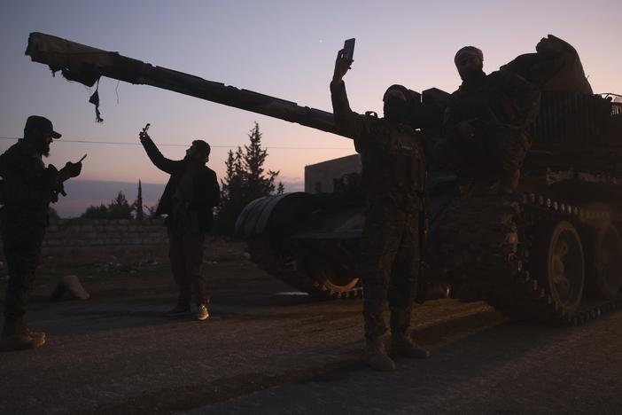 Opposition forces take control of areas outside Aleppo, Syria, on Friday.