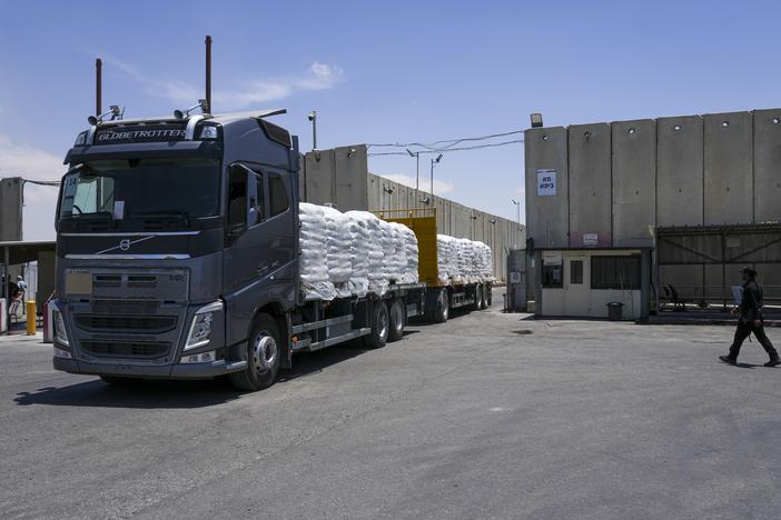 A truck with bundle of humanitarian aid for the Gaza Strip drive at the Kerem Shalom border crossing in southern Israel, Thursday, May 30, 2024.
