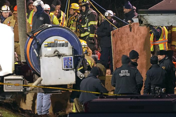 Rescue workers search in a sinkhole for Elizabeth Pollard, who disappeared while looking for her cat, in Marguerite, Pa., Tuesday, Dec. 3, 2024.
