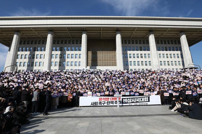 Lawmakers and members of South Korea's main opposition Democratic Party (DP) demonstrate against the country's president at the National Assembly on Wednesday in Seoul, South Korea.