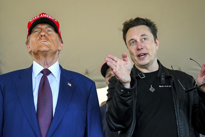 President-elect Donald Trump listens to Elon Musk as he arrives to watch SpaceX's mega rocket Starship lift off for a test flight from Starbase in Boca Chica, Texas, on Nov. 19.
