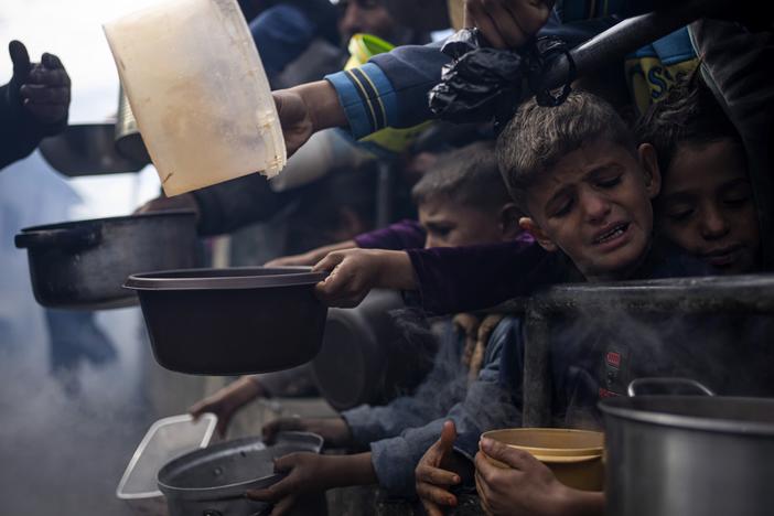 Palestinians line up for a meal in Rafah, Gaza Strip, Feb. 16.