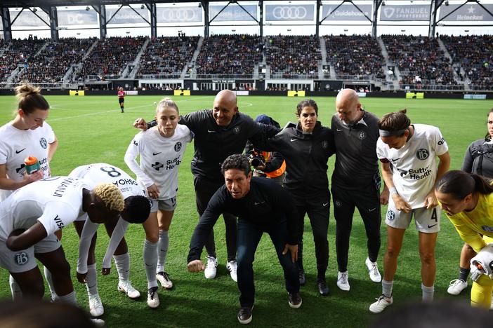 Players and coaches from Bay F.C. huddle before last Sunday's quarterfinal playoff game against the Washington Spirit in front of a sellout crowd at Audi Field in Washington, D.C.