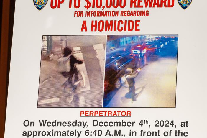 A wanted poster is set up for an NYPD press conference after United Healthcare CEO Brian Thompson was shot this week.