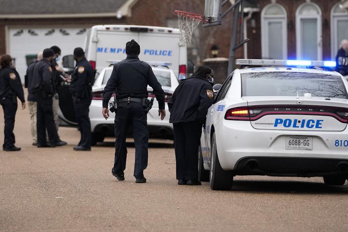 Memphis police officers work a crime scene in 2023. A new report says that "Memphis police officers regularly violate the rights of the people they are sworn to serve."