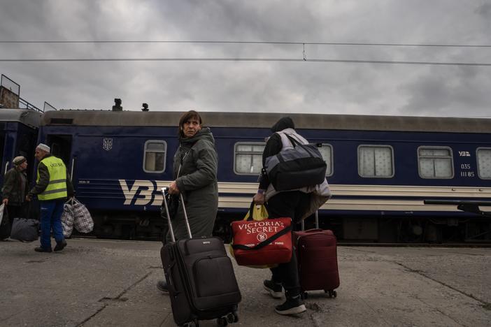 Evacuees from the city of Pokrovsk arrive at the train station in Pavlohrad, Ukraine, on Oct. 15. They are fleeing to cities in western Ukraine or other points in Europe. Pokrovsk, a coal mining center in eastern Ukraine, is under frequent Russian artillery barrages and aerial attacks.