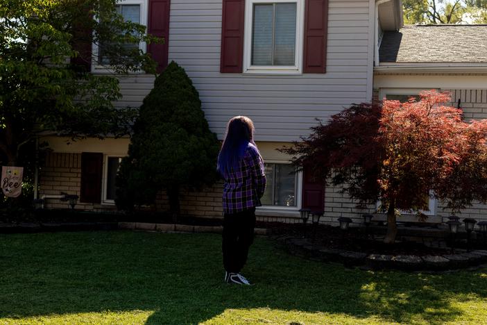 Randee Noggle stands in front of her home in Taylor, Mich., on June 30, 2024. She sold the house to the sale-leaseback company EasyKnock, which announced Thursday it's going out of business.