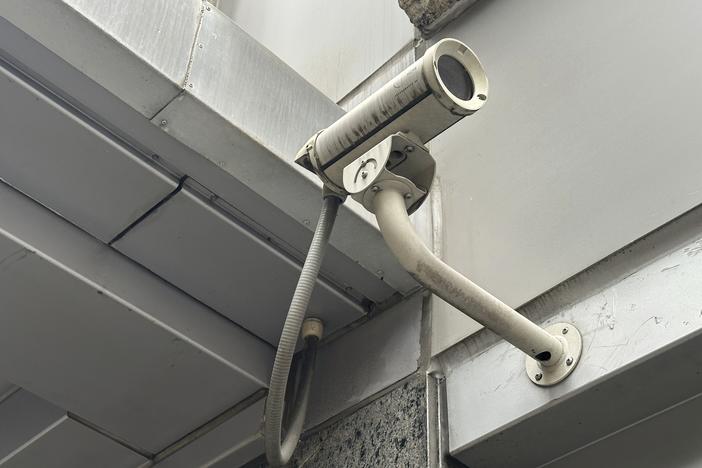 A surveillance camera is seen at the 54th Street entrance to the New York Hilton Midtown Hotel in New York on Thursday, where Brian Thompson, the CEO of UnitedHealthcare, was fatally shot on Wednesday.