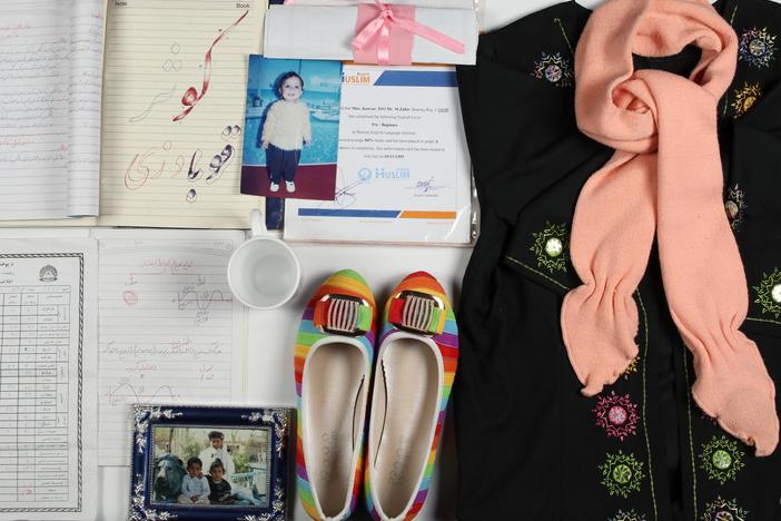 The Afghanistan Memory Home Museum creates "memory boxes" with personal belongings and photographs and documents for those who suffered or died in the country's conflicts. This memory box memorializes Kawsar Qubadian and includes her sweater and slippers.
