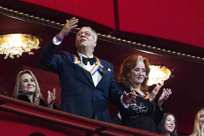 2024 Kennedy Center honoree jazz trumpeter, pianist, and composer Arturo Sandoval, blows a kiss as fellow honoree blues rock singer-songwriter and guitarist Bonnie Raitt, applauds as they arrive during the 47th Kennedy Center Honors at the John F. Kennedy Center for the Performing Arts in Washington, Sunday, Dec. 8, 2024.