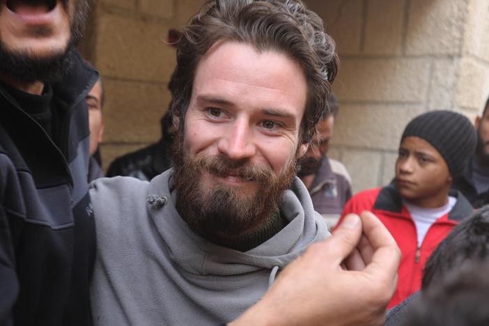 Travis Timmerman, a U.S. citizen who had entered Syria from Lebanon on a Christian pilgrimage and had been detained for several months, speaks with reporters in Damascus on Thursday, after he was found in the village of Thihabiyeh east of the capital following the fall of longtime Syrian President Bashar al-Assad.