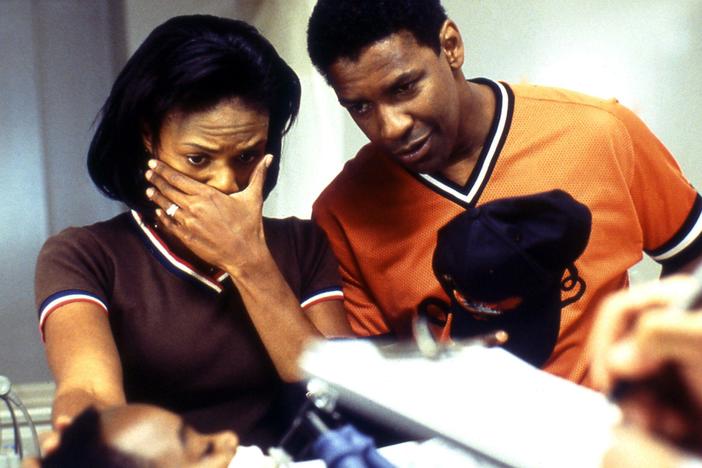 In the 2002 medical thriller <em>John Q, </em>Denzel Washington and Kimberly Elise play parents who learn that their 9-year-old son's heart transplant won't be covered by insurance.