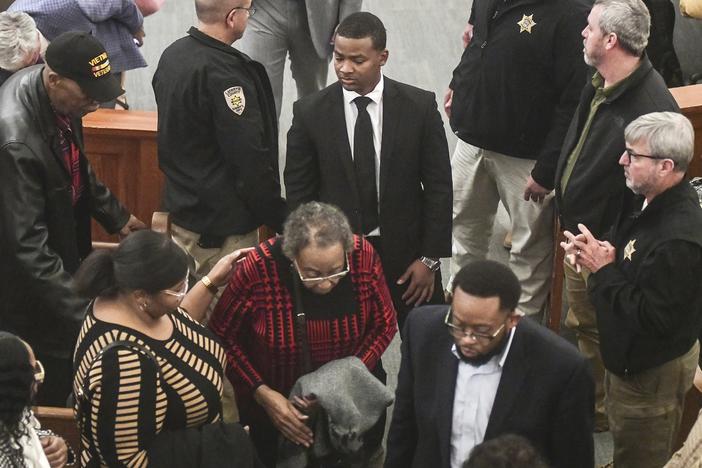 Sheldon "Timothy" Herrington Jr., center, who was on trial for the murder of University of Mississippi student Jimmie "Jay" Lee, joins family as they leave court after a mistrial was declared, at the Lafayette County Courthouse in Oxford, Miss. on Wednesday.