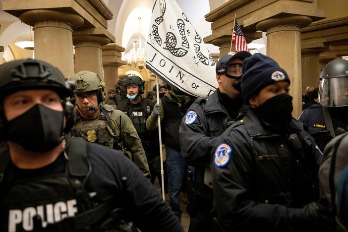 FBI and ATF law enforcement push out supporters of then-President Donald Trump as they protested inside the U.S. Capitol on January 6, 2021.