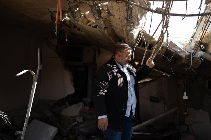 Khalil Moussa Shoumar, 55, stands in the rubble of his home. Shoumar is an auto parts seller whose house in Nabatieh was destroyed by Israeli airstrikes twice, first in 2006 and again in October.