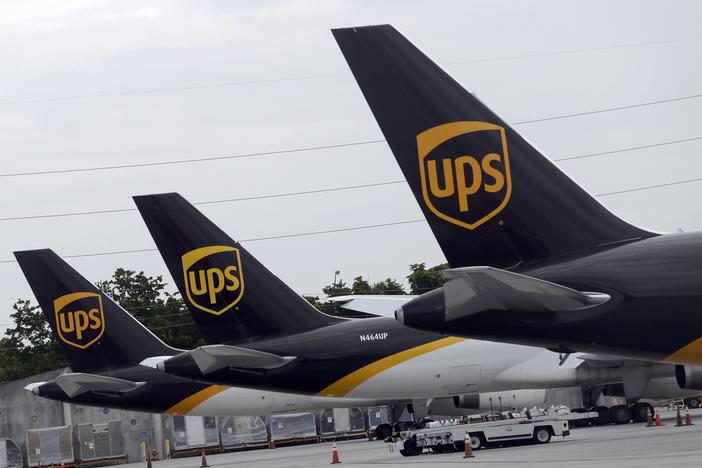 In this July 27, 2020, file photo, the tails of three UPS aircraft are shown parked at Miami International Airport in Miami.