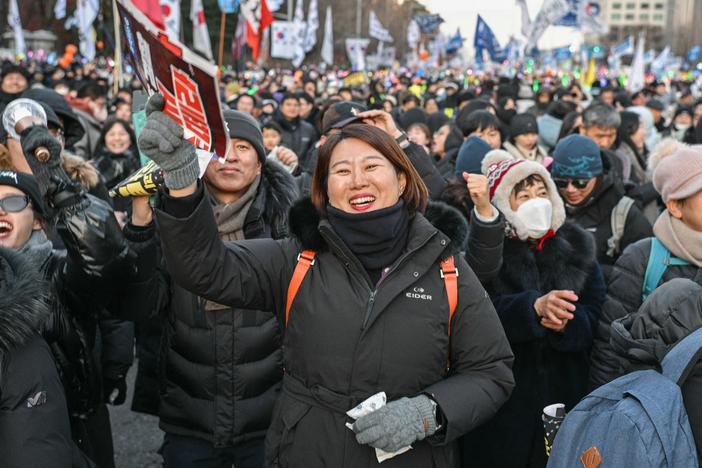 Protesters calling for the ouster of South Korea President Yoon Suk Yeol react after the result of the second martial law impeachment vote outside the National Assembly in Seoul, on Saturday.