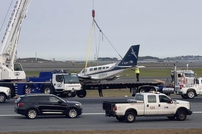 In this image made from video, officials remove a small plane that landed at Logan International Airport after having only one of its landing wheels deploy, Tuesday, Sept. 17, 2024, in Boston.