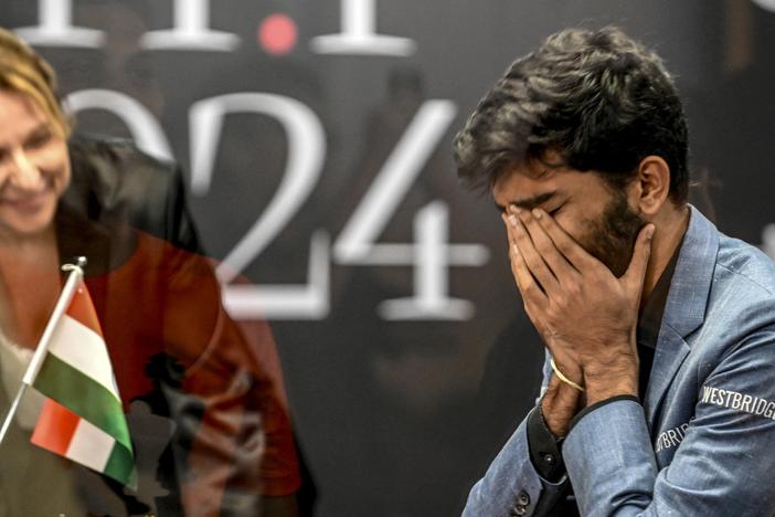 India's grandmaster Gukesh Dommaraju reacts after winning against China's chess grandmaster Ding Liren in game 14 of the 2024 FIDE World Championship in Singapore on Thursday.