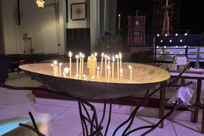 During St. Augustine by-the-Sea's annual Blue Christmas service, congregants light candles and pray for all the things that aren't right in their own lives and in the world.