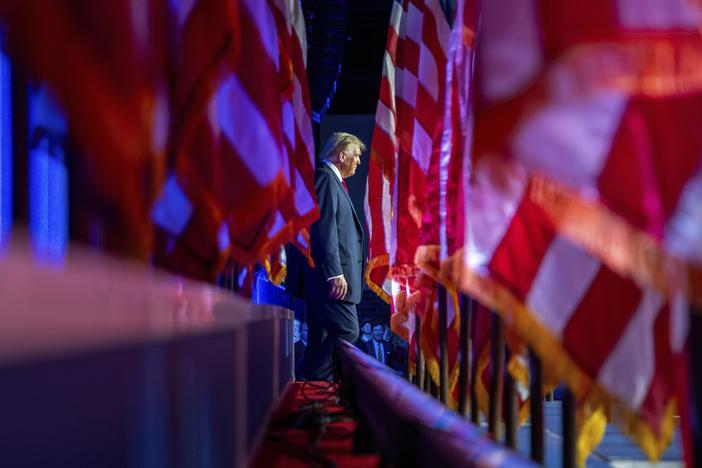 Republican presidential nominee and former President Donald Trump arrives at an election night watch party at the Palm Beach Convention Center on Nov. 6, in West Palm Beach, Fla.