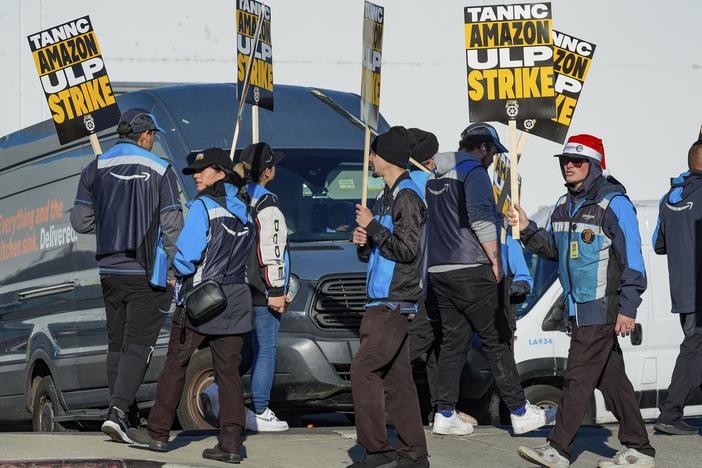 Amazon workers strike outside the gates of an Amazon fulfillment center in City of Industry, Calif., on Thursday.