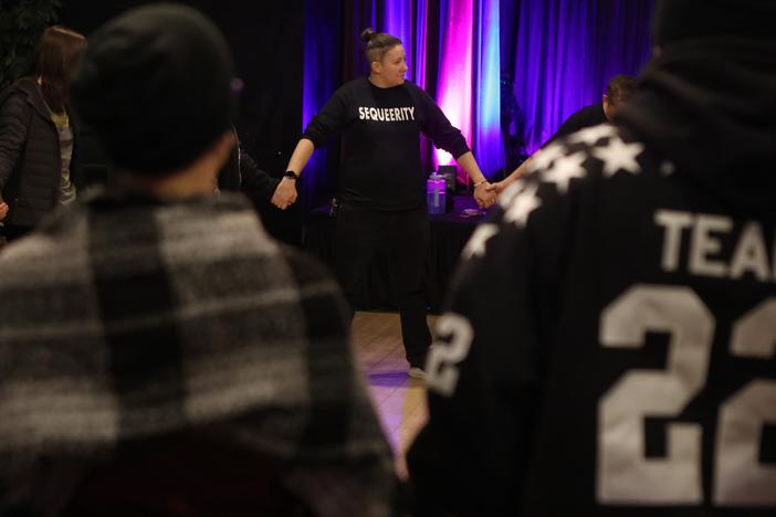 Sam Koshiol-Wright of Sequeerity helps lead a community outreach event in Minneapolis, Minn., Dec. 4.