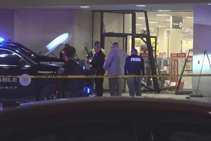 This image taken from video provided by KCEN-TV shows police responding after a man drove a vehicle into a JCPenney at a shopping mall Saturday, Dec. 21, 2024, in Killeen, Texas.