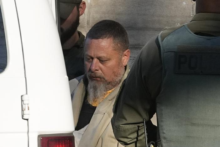 Officers escort Richard Allen out of the Carroll County Courthouse following a hearing Nov. 22, 2022, in Delphi, Ind.