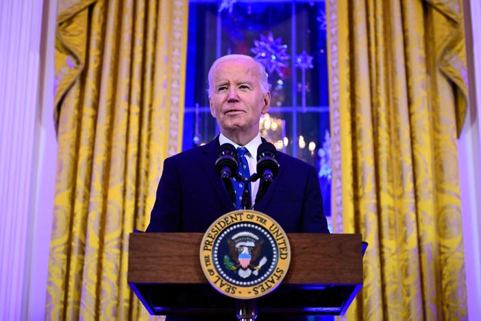 President Biden speaks during a reception in the East Room of the White House on Dec. 16.