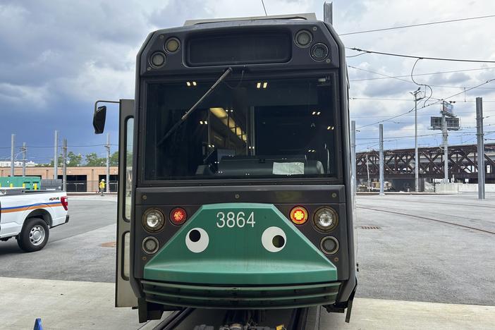 An MBTA subway car dons googly eyes under its front windshield in Boston.