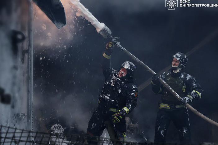 In this image provided by the Ukrainian Emergency Service, firefighters put out a fire following a Russian missile attack on the country's energy system in Dnipropetrovsk region, Ukraine, on Wednesday.