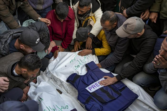 Relatives and friends mourn over the bodies of five Palestinian journalists who were killed by an Israeli airstrike in Gaza City at the Al-Aqsa Hospital in Deir al-Balah, on Thursday.