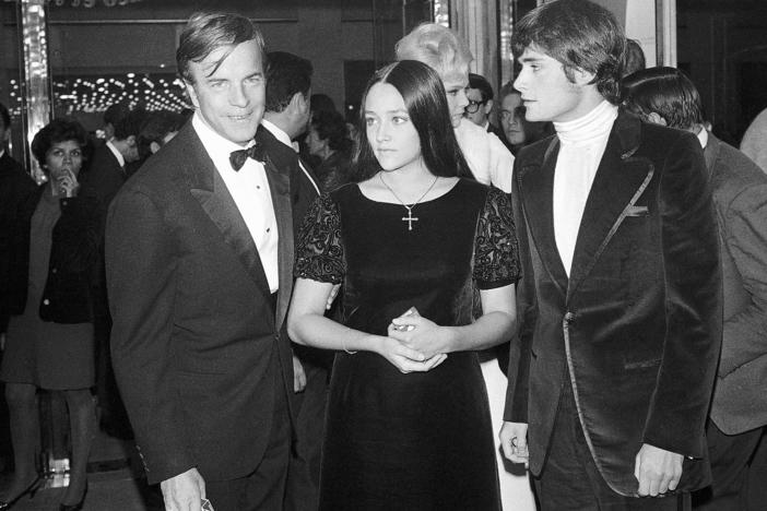 "Romeo and Juliette" movie director Franco Zeffirelli (from left), actors Olivia Hussey and Leonard Whiting are seen after the Parisian premiere of the film in Paris on Sept. 25, 1968.