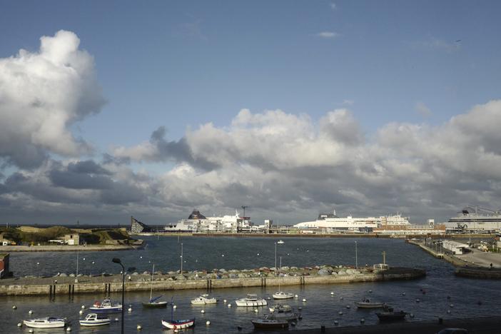 Ferries, background, dock in the port of Calais, northern France, in November 2021. At least 76 people have died crossing the English Channel in 2024, making it the deadliest year on record for small boat crossings.