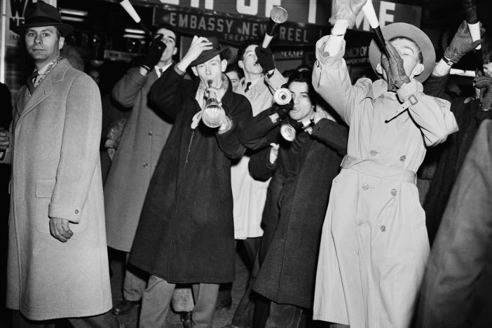 Revelers celebrate the new year on Jan. 1, 1942, in Times Square. Its New Year's Eve ball drop attracts millions of viewers — at home and in the streets of New York City — every year.