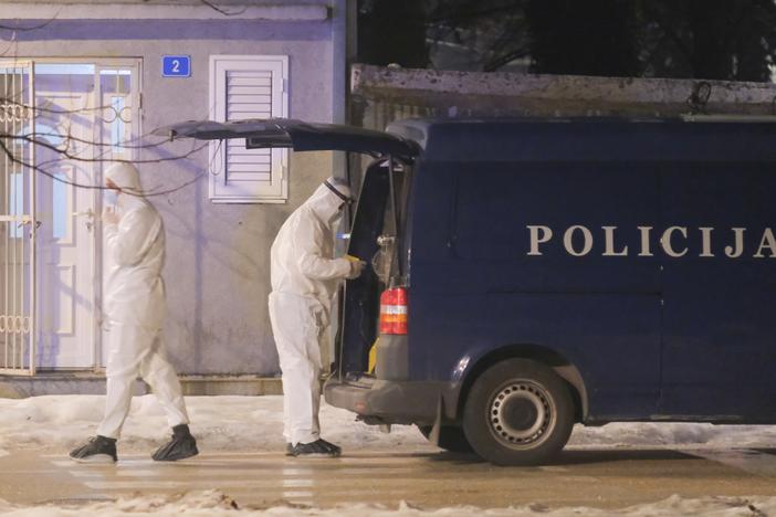 Police investigators work at the site of a shooting in Cetinje, located 22 miles west of Podogrica, Montenegro, Wednesday, Jan 1, 2025.