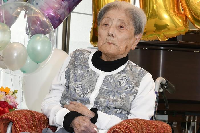 This photo provided by Ashiya City shows Tomiko Itooka, being celebrated for her 116th birthday at the nursing home she lives in Ashiya, western Japan, on May 23, 2024.