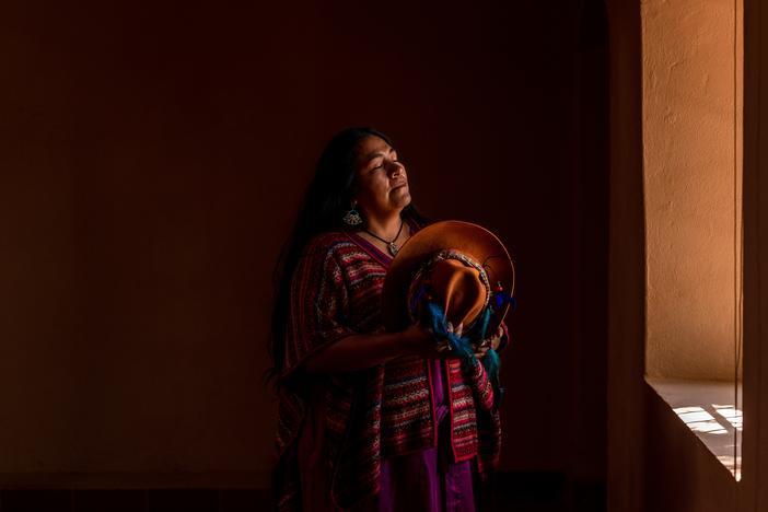Ilia Reyes Aymani, a researcher and teacher, has written short songs in Ckunsa, a once-extinct Indigenous language, to teach colors and numbers to the local children. She stands for a portrait in San Pedro de Atacama in Antofagasta, Chile, on April 15. <a href="https://www.npr.org/2024/10/14/nx-s1-5148780/chile-lost-language-atacama-desert"target="_blank"   >Click here for the full story. </a>