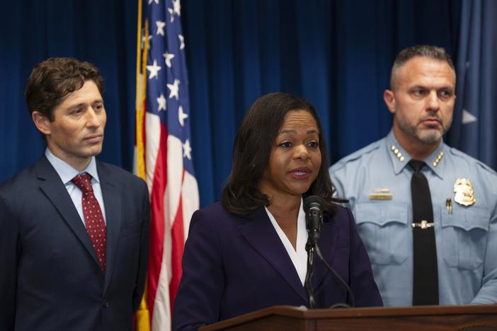 Assistant Attorney General Kristen Clarke of the Justice Department's Civil Rights Division, flanked by Minneapolis Mayor Jacob Frey, left, and Chief Brian O'Hara of the Minneapolis Police Department, speaks at a news conference at the U.S. Courthouse in Minneapolis, Monday, Jan. 6, 2025.